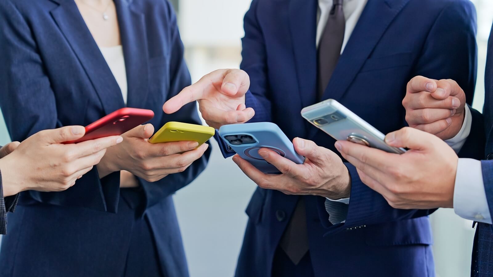 A,Group,Of,Business,People,Using,Apps,And,Watching,Videos