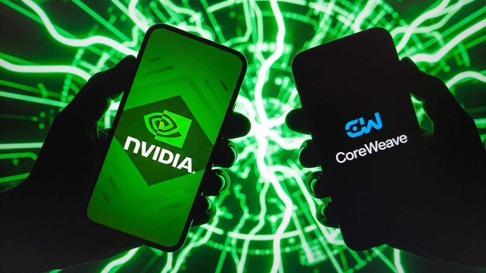Hands,Hold,Smartphones,Displaying,Nvidia,And,Coreweave,Logos,Against,A
