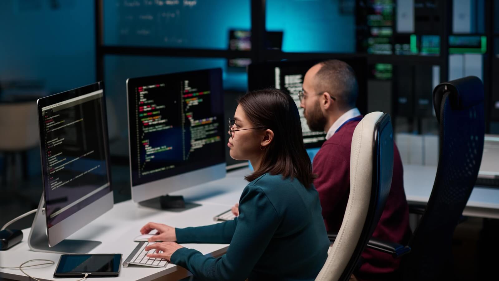 High,Angle,View,At,Two,People,Sitting,At,Workplace,In