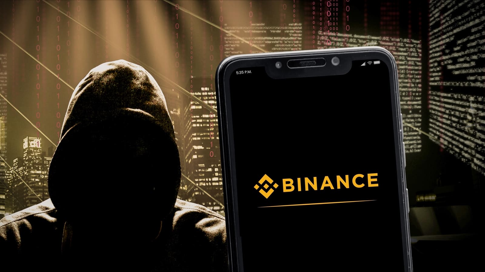 Hacker encapuchado junto a un smartphone con la aplicación de Binance, representando un ciberataque a Binance.